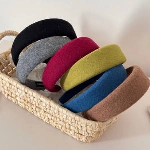 Thick wool felt headband set in multiple colors with handmade label in a woven basket