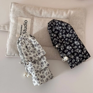 French floral hair clip with pearls in black and white fabric for ponytail styling