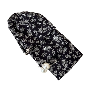 Floral fabric hair clip with elegant pearl pendants and black pattern design