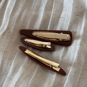 Three-piece set of deep brown resin hair clips with elegant gold metal clips for thick hair