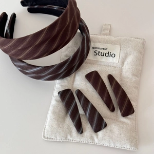 Brown twill headband and hair clips set with beige and light blue striped fabric texture