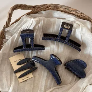 Handmade denim fabric hair claw clip set with yellow stitching and retro blue finish