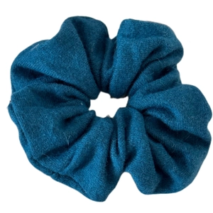 Lush teal blue knitted scrunchie for women with elegant winter wool texture and soft pleats