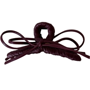 Elegant deep burgundy bow-shaped shark clip with leather texture for vintage hair styling