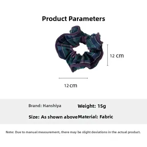 Detail showing blue and purple plaid checkered scrunchie with 12cm diameter and bow design