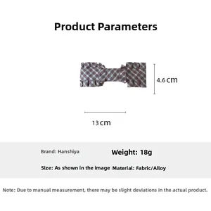 Detailed view of large brown plaid bow hair clip showing dimensions of 13cm by 4.6cm
