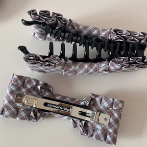 Detail of Korean plaid bow hair clips featuring banana and spring clips with ruffle fabric