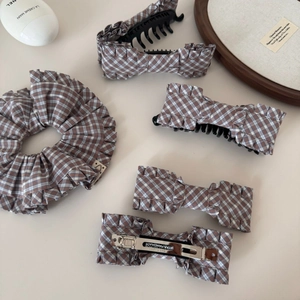 Five-piece brown checkered bow hair clip set with ruffle edges and matching scrunchie