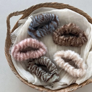 Plush faux fur cloud hair claws in five colors including tiger print and neutral tones