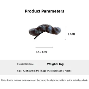 Detail view of plush fabric hair clip showing 12.5cm length and dimensions on white background