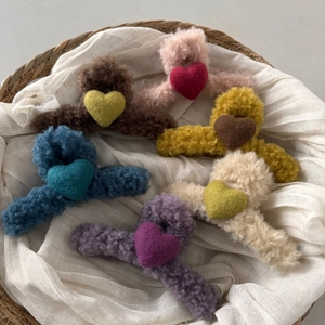 Fleece heart-shaped hair claw set with plush texture in six warm autumn and winter colors