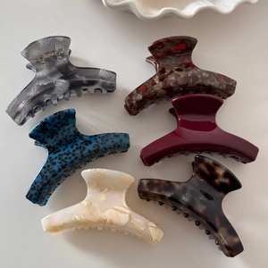Set of 6 small acetate hair claws in various marble and tortoiseshell patterns for women