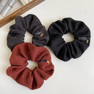 Three-piece velvet scrunchie set with polka dots and lucky charms in grey, black and red