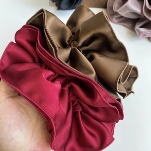 Luxurious four-layer satin scrunchie with elegant ruffled texture in wine red and coffee brown