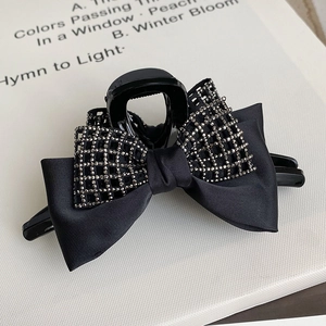 Elegant black satin bow hair claw clip with silver rhinestone grid pattern for women