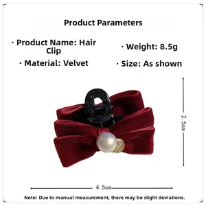 Detailed view of red velvet hair claw clip with pearl decoration and dimensions 4.5cm