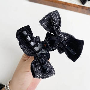 Elegant French wool bow hair claw clip in black velvet and tweed texture design