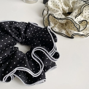 Elegant black and white polka dot scrunchie set with pleated ruffle edges and premium texture