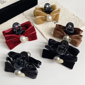 Elegant bow hair claw clips with pearls and gold pendants in multiple colors for women