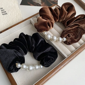 Elegant velvet scrunchies with pearl embellishment in black and brown colors