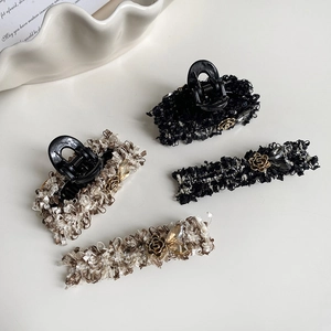Elegant tweed hair clip set with gold camellia details and vintage chic aesthetic