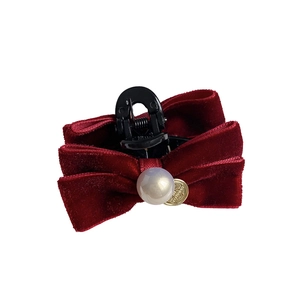 Elegant velvet bow hair claw clip with faux pearl and gold pendant in wine red