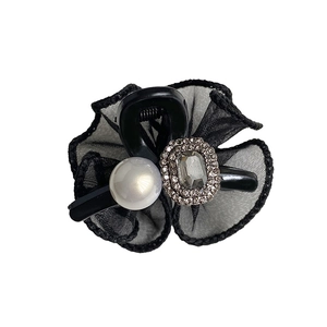 Elegant black mesh bow hair claw with sparkling rhinestones and white pearl detail