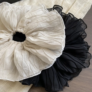Oversized pleated scrunchies in cream and black colors for elegant ponytail styling