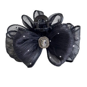 Elegant black mesh bow hair claw clip with silver rhinestones and a central crystal