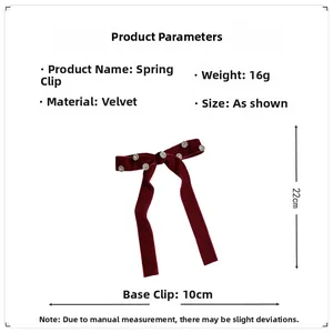 Detailed view of dark red velvet bow clip with rhinestones and 10cm spring mechanism