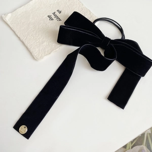 French style black velvet bow hair tie with long ribbons and a gold metallic logo pendant