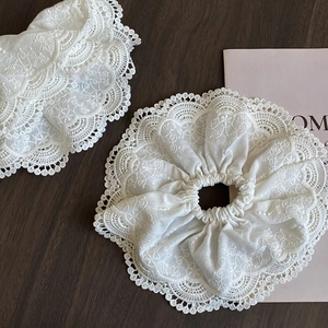 Elegant white lace scrunchie set with intricate floral embroidery and vintage design