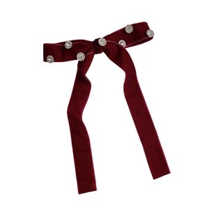 Elegant burgundy velvet bow hair clip with sparkling rhinestone flower embellishments