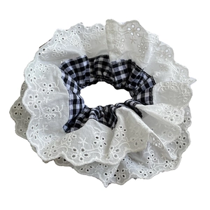 French lace scrunchie with black and white checkered fabric and floral embroidery