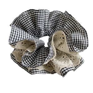 French retro oversized gingham scrunchie with beige lace edges on a white background