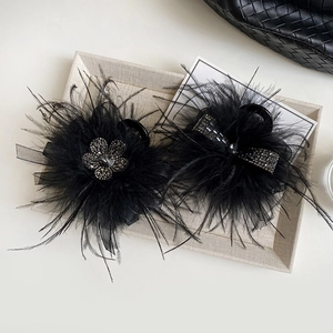 Elegant black feather hair claw clips with rhinestones and bows for party hairstyles