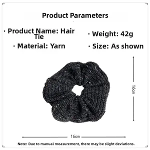Detail view of dark grey knitted hair scrunchie showing 16cm diameter and 42g weight