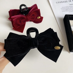 Elegant velvet bow hair claw clips in black and burgundy with gold metal Wing tag detail