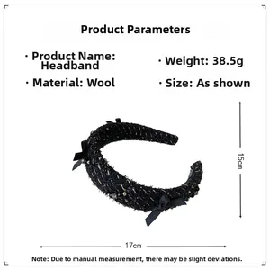 Detailed view of black woolen headband with chic knit texture, small beads and bow