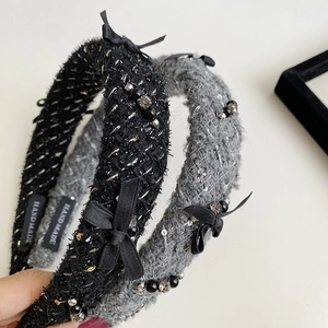 Detailed close-up of tweed headbands with chic ribbon bows and beaded embellishments