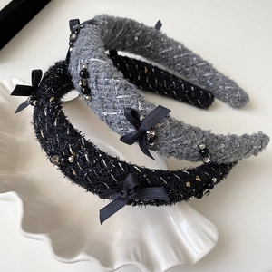 Elegant tweed headbands with black bows and pearl accents in gray and black styles
