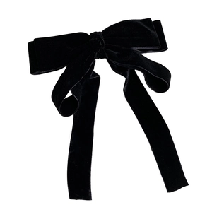 Classic black velvet bow hair clip with long ribbons on a clean white background
