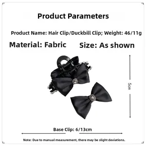 Detailed view of black fabric bow hair clips with silver rhinestones and measurements