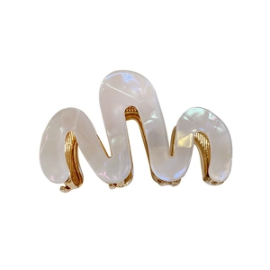Elegant wavy pearlescent acetate hair claw clip with golden metal base for women