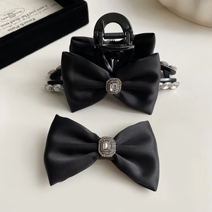 Elegant black satin bow hair clip set with sparkling rhinestones in French retro style
