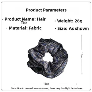 Detail of 15cm oversized dark plaid scrunchie made of premium fabric 26g weight