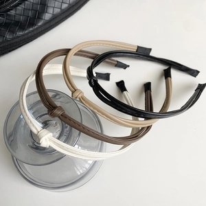 Chic knotted faux leather headband set in white, brown, beige, and black colors