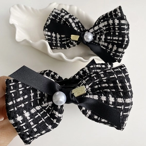 Elegant houndstooth tweed bow hair claw clips with white pearls and gold metal accents
