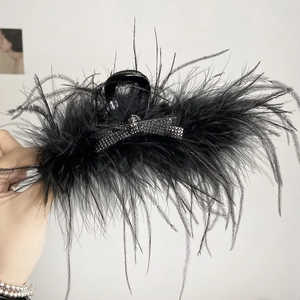 Detail of 13cm black feather hair claw clip with crystal bow decoration for women