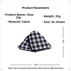 Detailed dimension view of black and white plaid fabric triangle hair claw clip